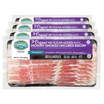 Four packages of Pederson's Hickory Smoked Uncured Bacon arranged in a stack on a white background.